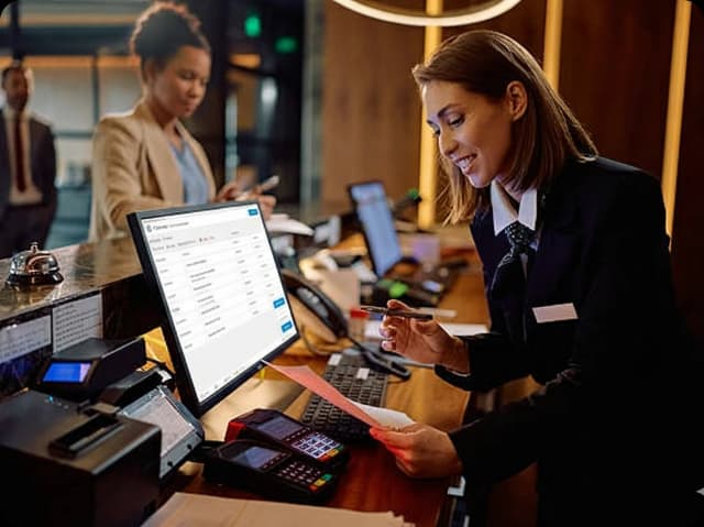 Staff managing POS system with Tryzen Solution